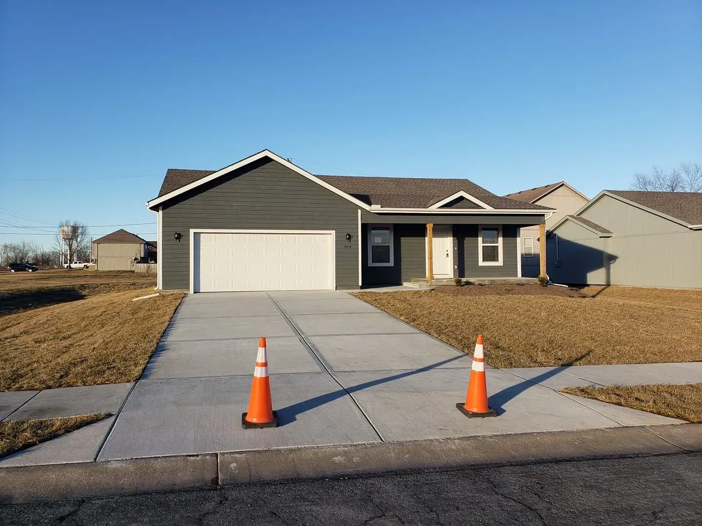 Gray house with white garage door