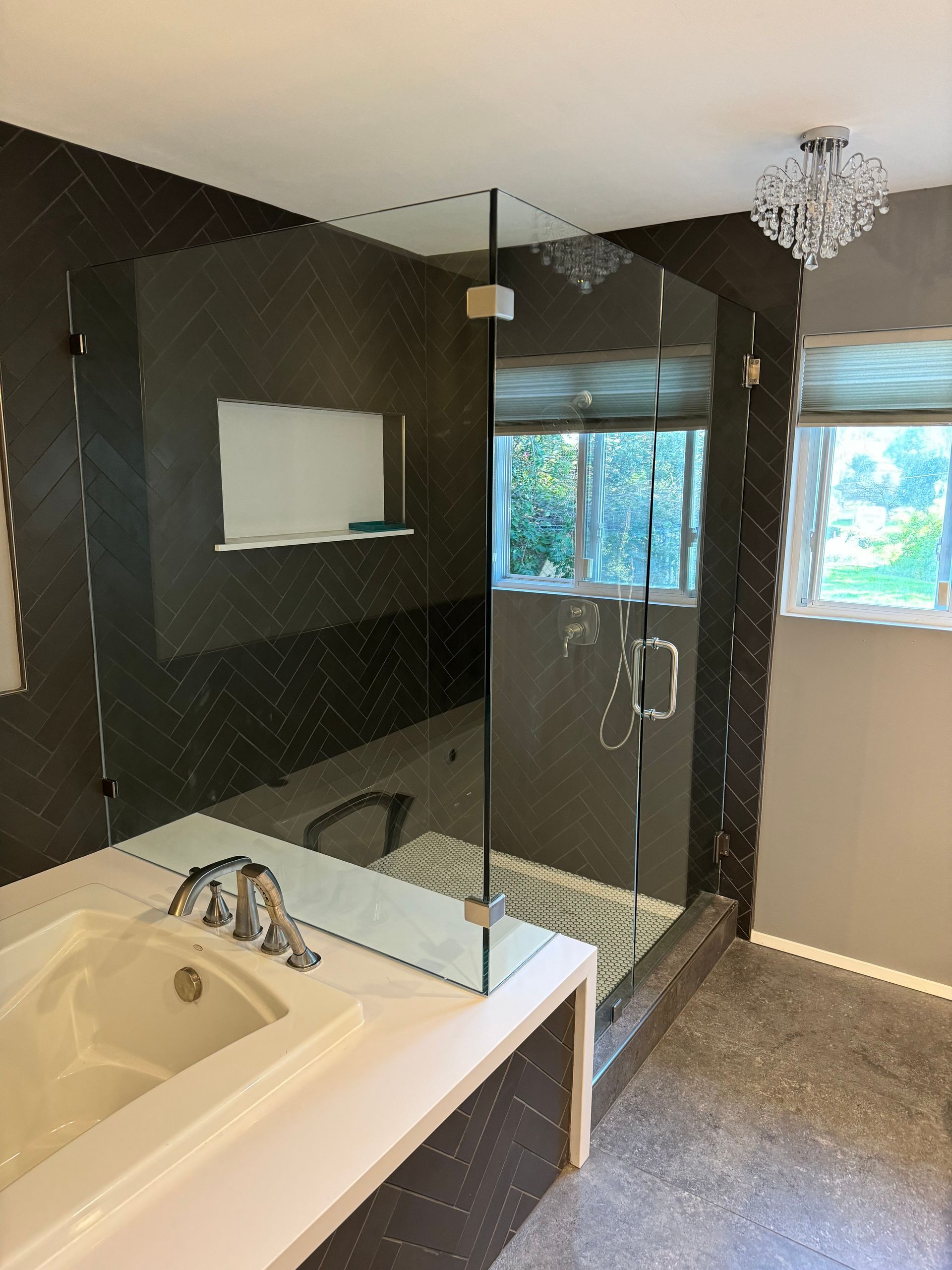 A bathroom with a tub and a walk in shower