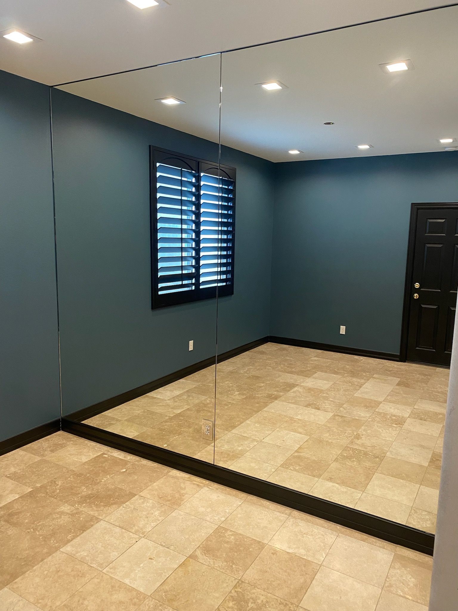 There is a large mirror in the middle of the room.