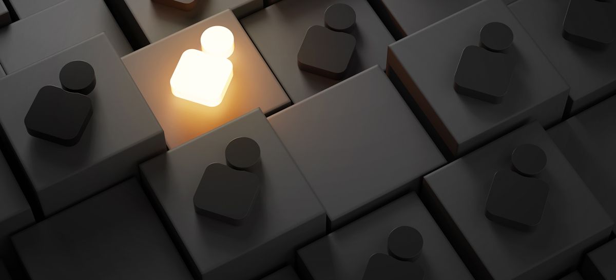 A single glowing, illuminated white human-shaped icon stands out among several dark gray, identical icons on a grid.