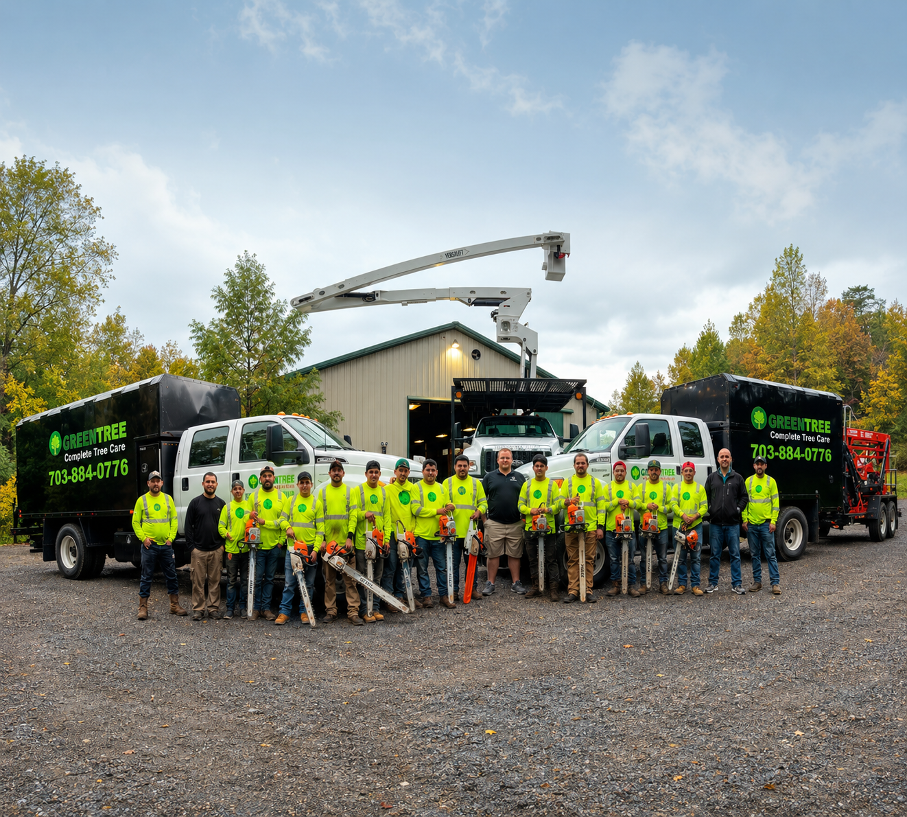 Crew in neon safety shirts posing with trucks outside a warehouse under a blue sky