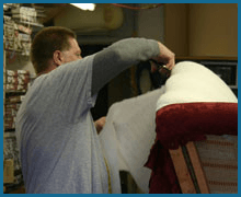 man doing upholstery