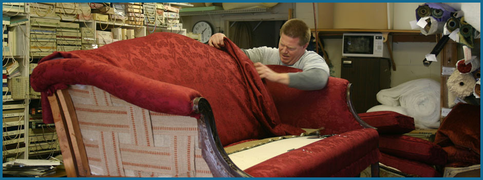 man doing upholstery