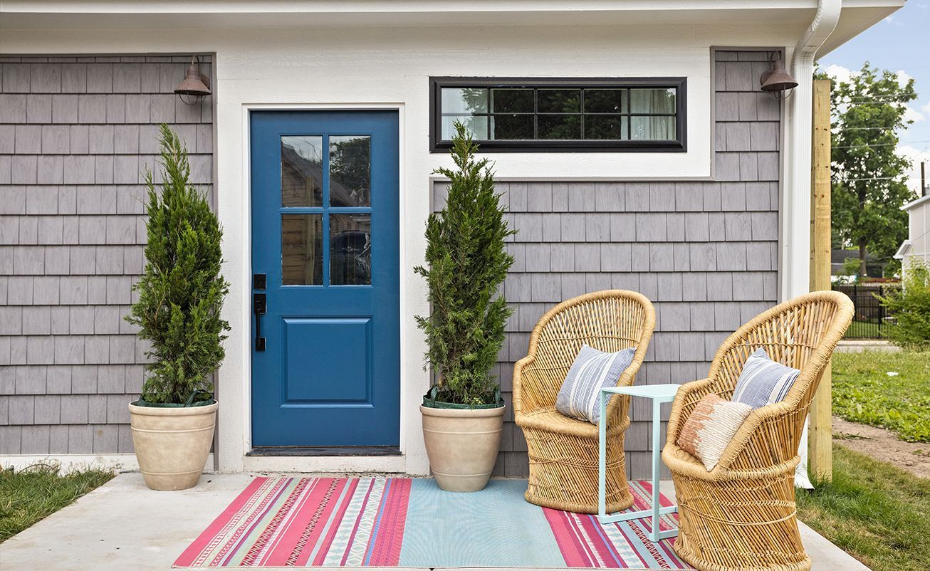 wooden chairs with blue door