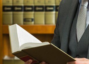 lawyer holding a law book