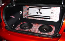 Speakers of red vehicle.