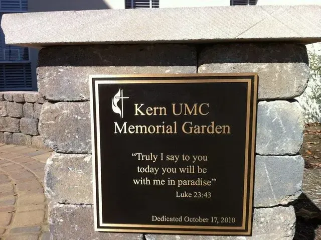 Plaque for Kern UMC Memorial Garden on a stone pillar, with text of Luke 23:43, dedicated October 11, 2010.