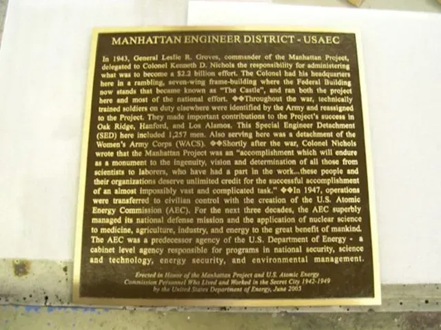 Bronze plaque: Manhattan Engineer District - USAEC; historical text about the Manhattan Project.