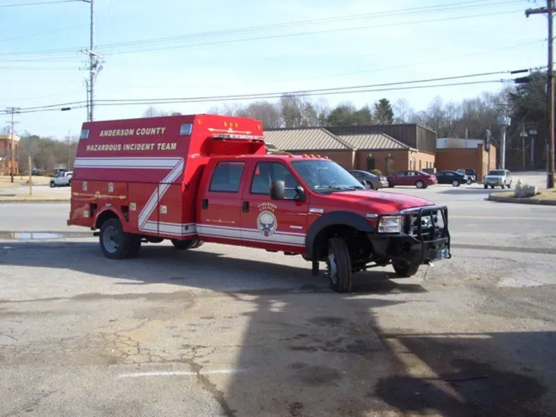Red Anderson County Hazardous Incident Team truck parked on pavement.
