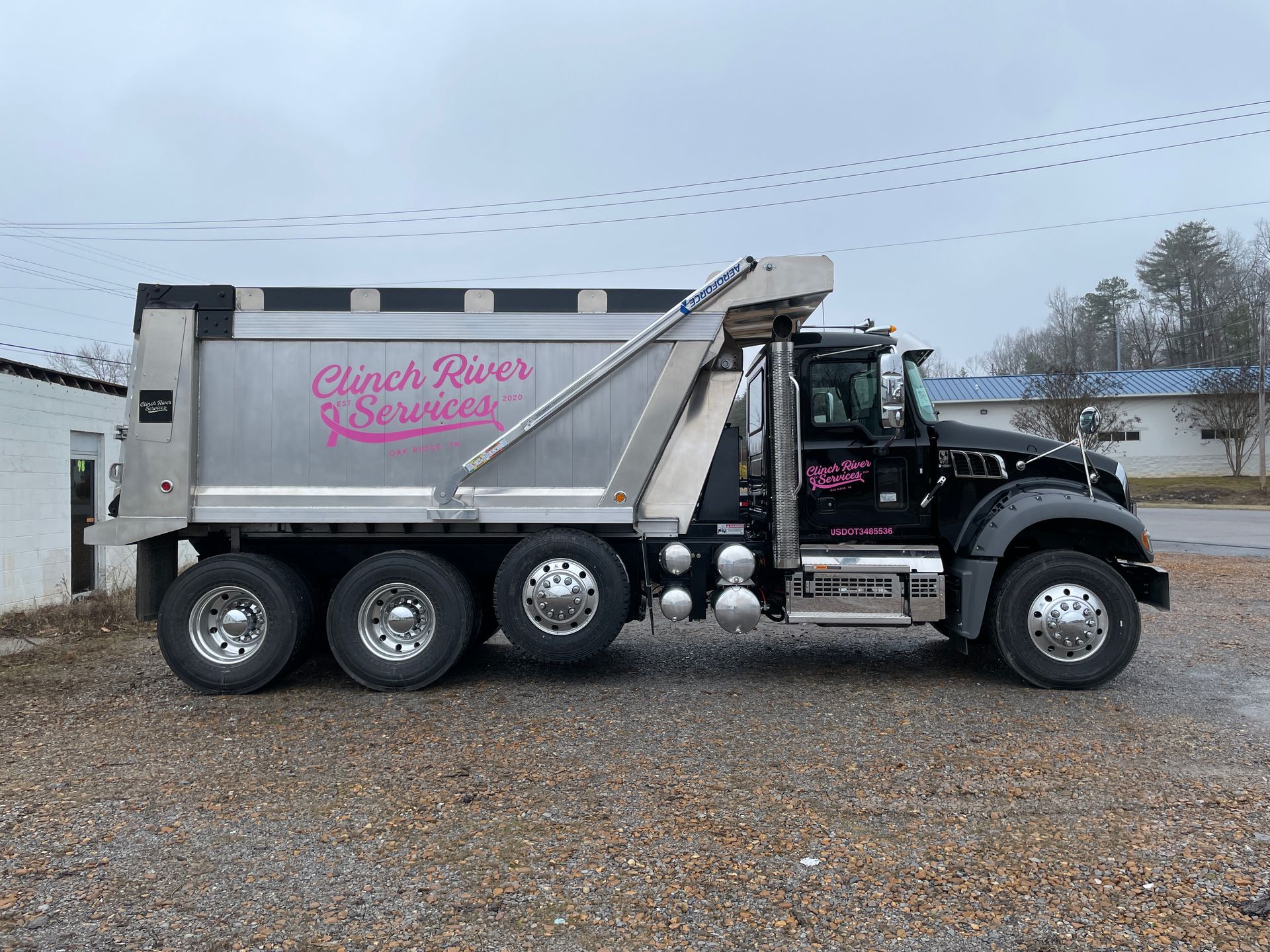 Black dump truck with silver bed; 