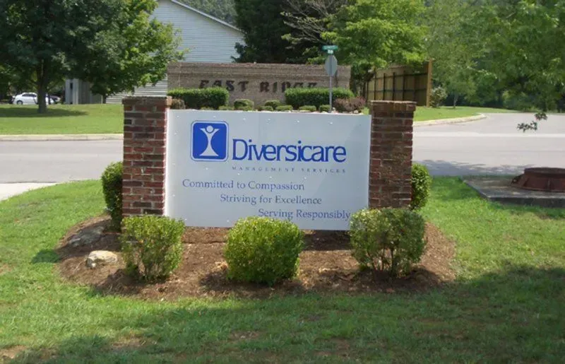 Sign for Diversicare in front of brick columns and landscaping. 