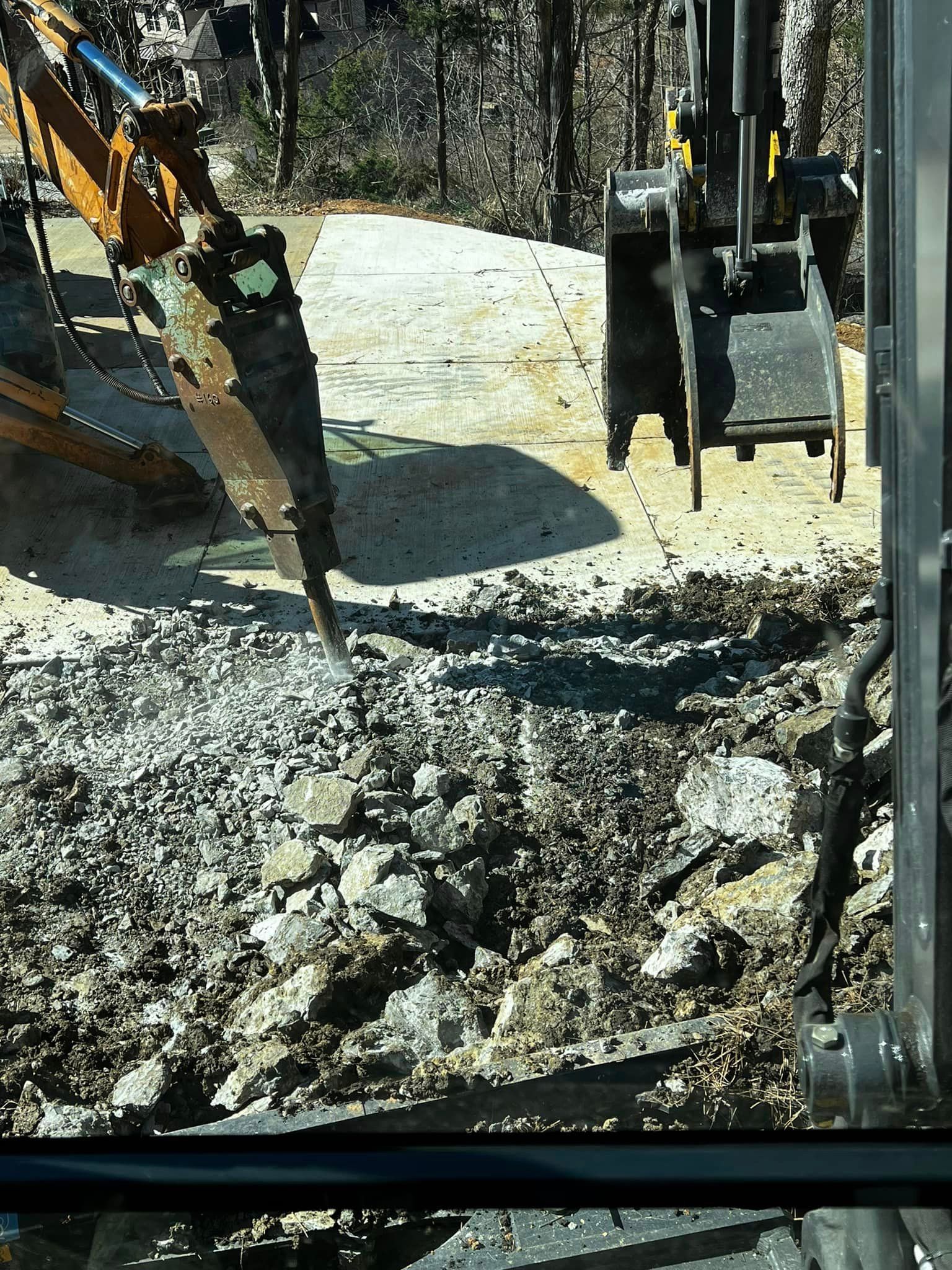 A bulldozer is digging a hole in the ground.