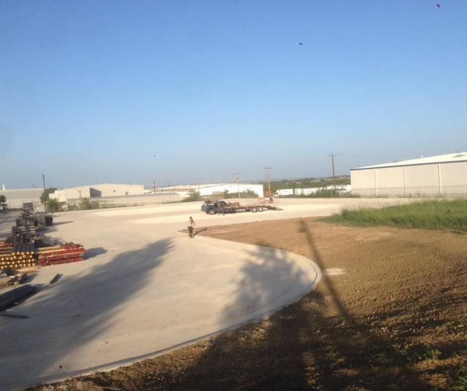 A parking lot with a lot of trucks parked in it