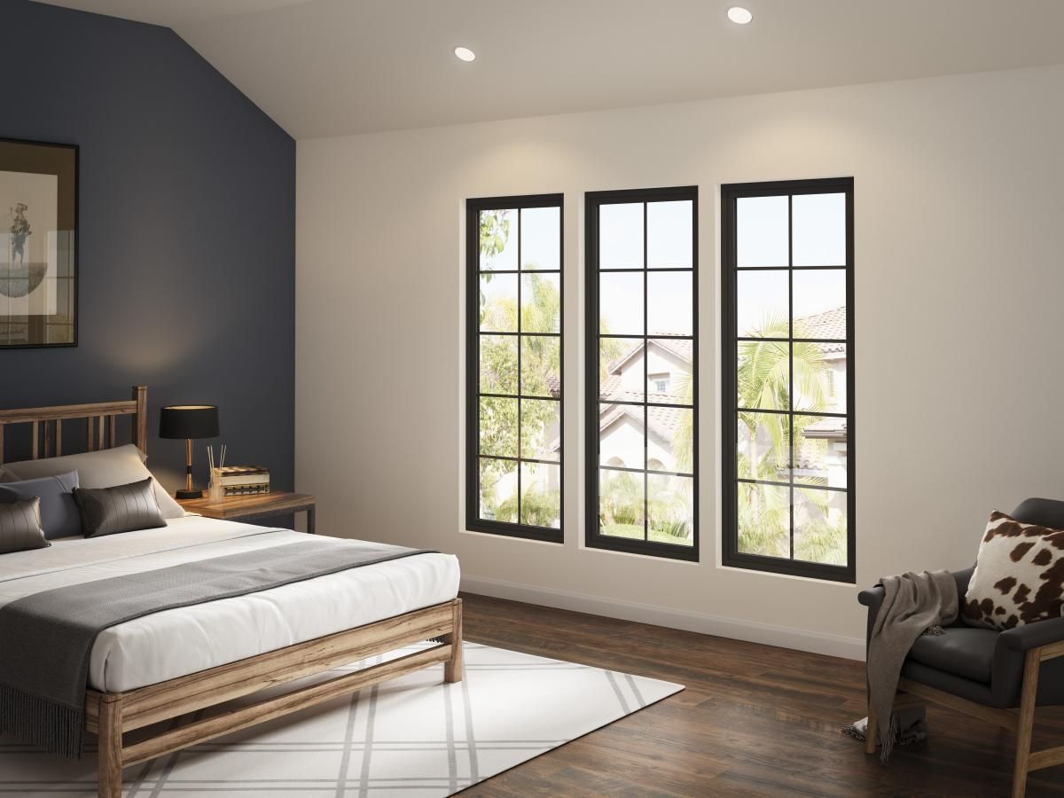 Modern bedroom with a bed, armchair, dark accent wall, and three tall windows.