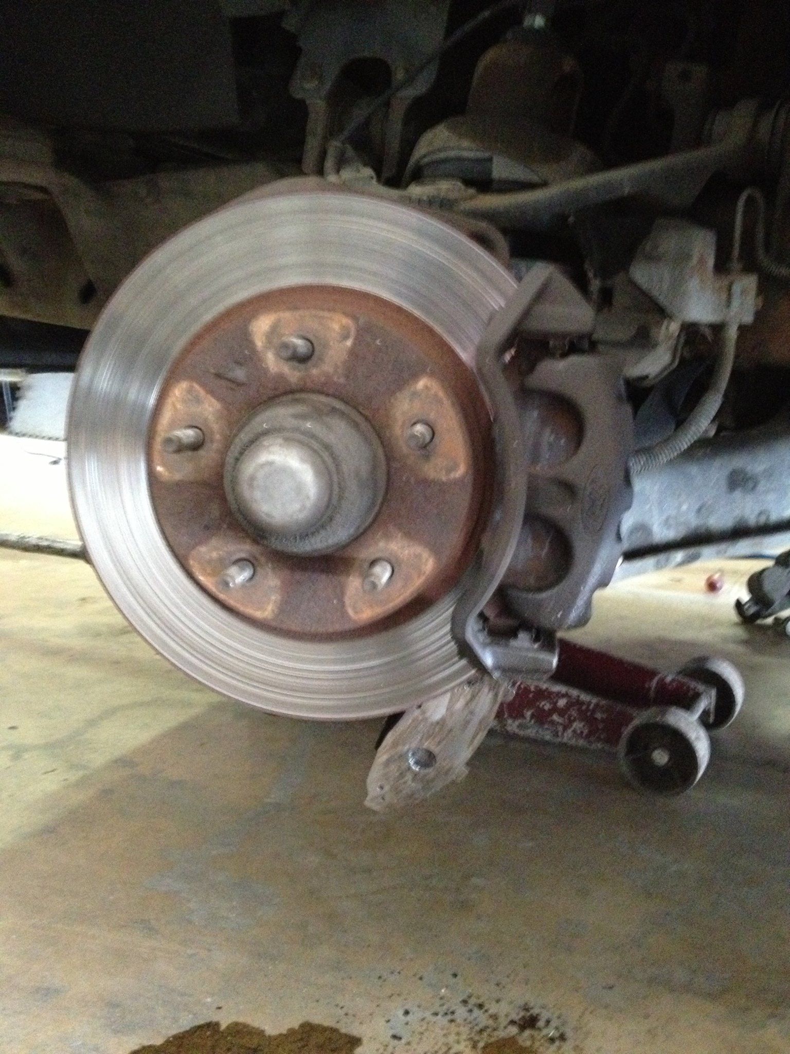 A close up of a brake disc on a car