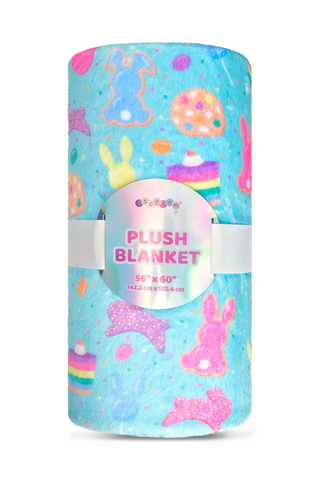 A blue plush blanket with easter bunny cookies and eggs on it.