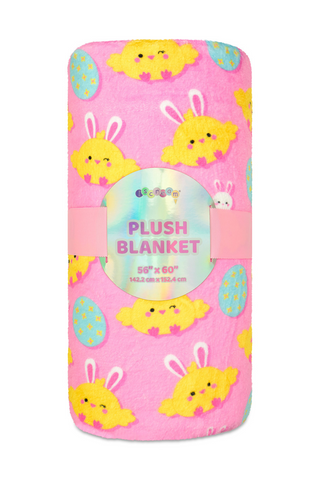 A pink plush blanket with easter bunnies and eggs on it