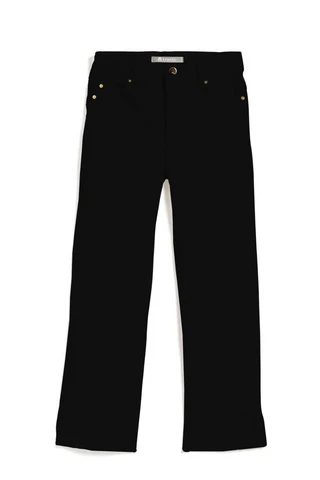 A woman is wearing a white blouse and green pants.