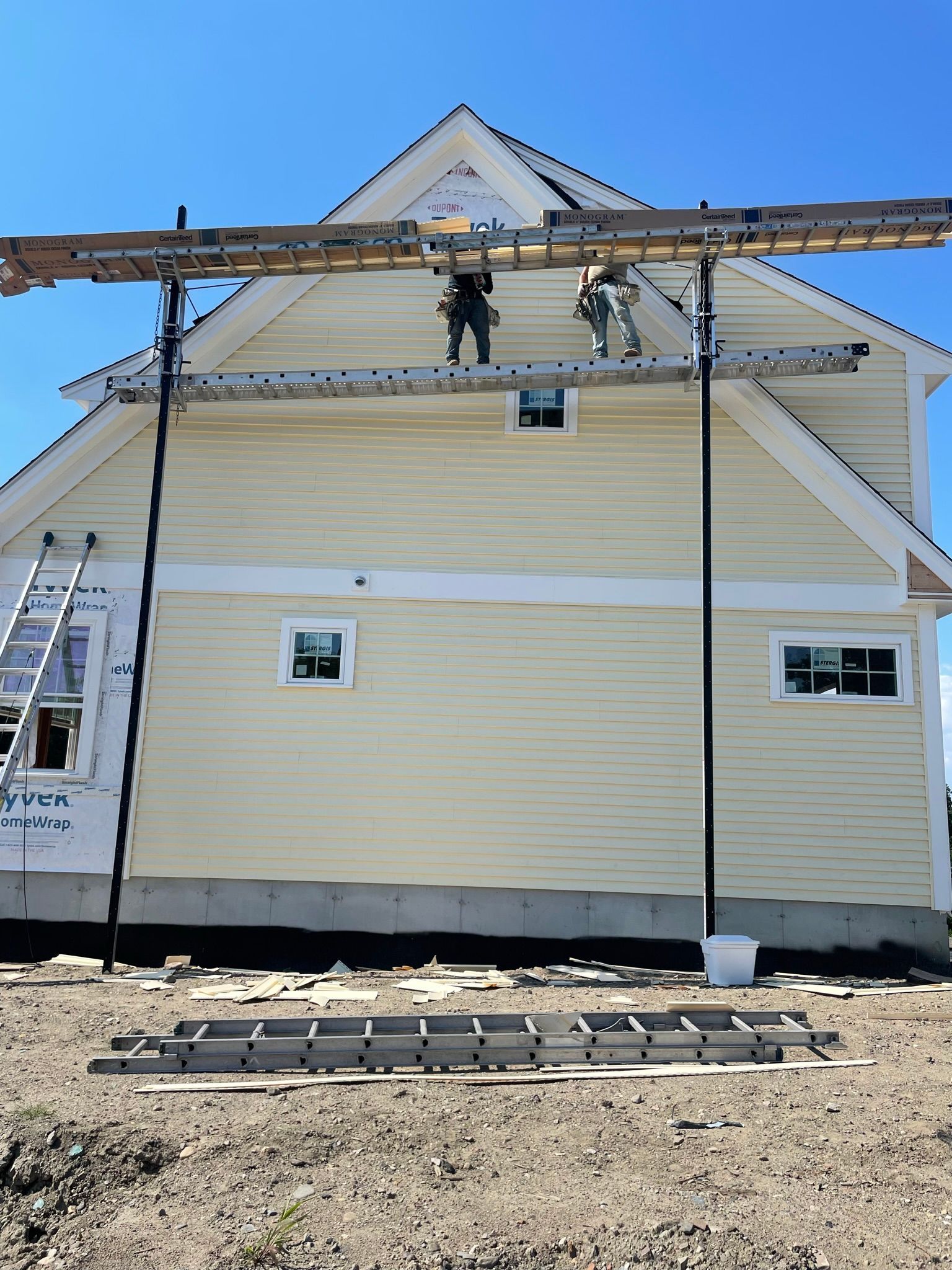 Roofing company staff working on residential roofing project
