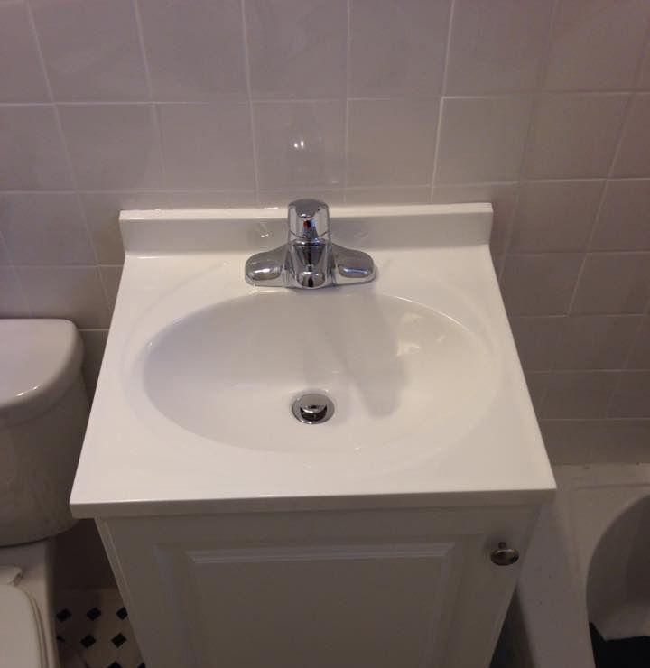 A wooden table topped with a variety of chocolates and nuts