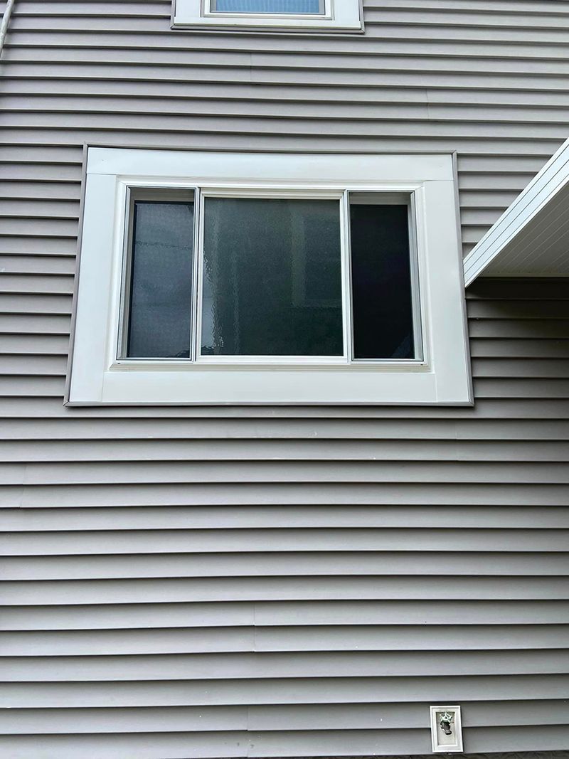 There is a window on the side of a house.