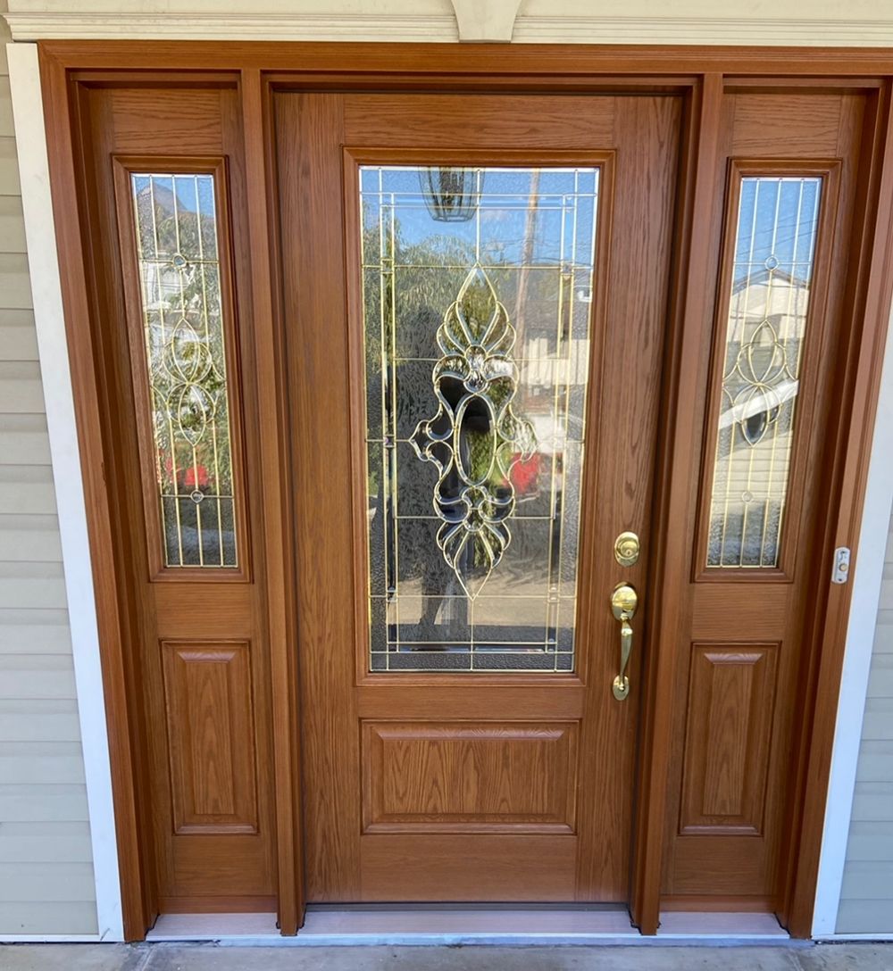 A wooden door with a stained glass window on the front of a house.