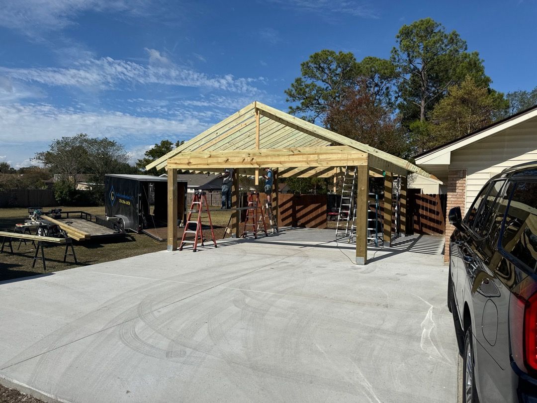 A truck is parked in front of a house under construction.