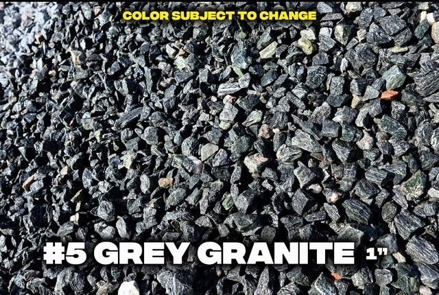 Grey granite rock, close-up view, dark grey with bits of other colors