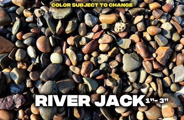 Close-up of a pile of mixed-color river rocks, ranging from brown to gray