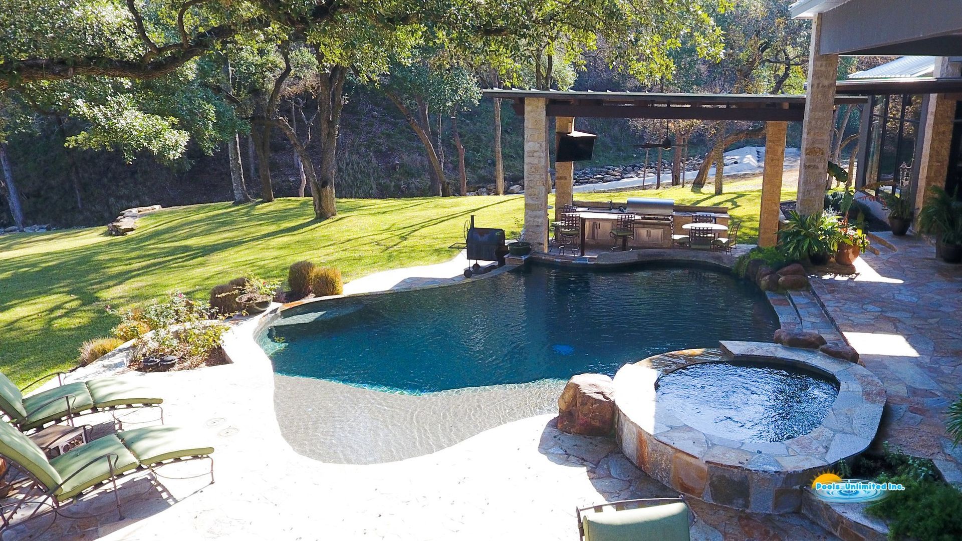 A large swimming pool with a hot tub in the middle of it.