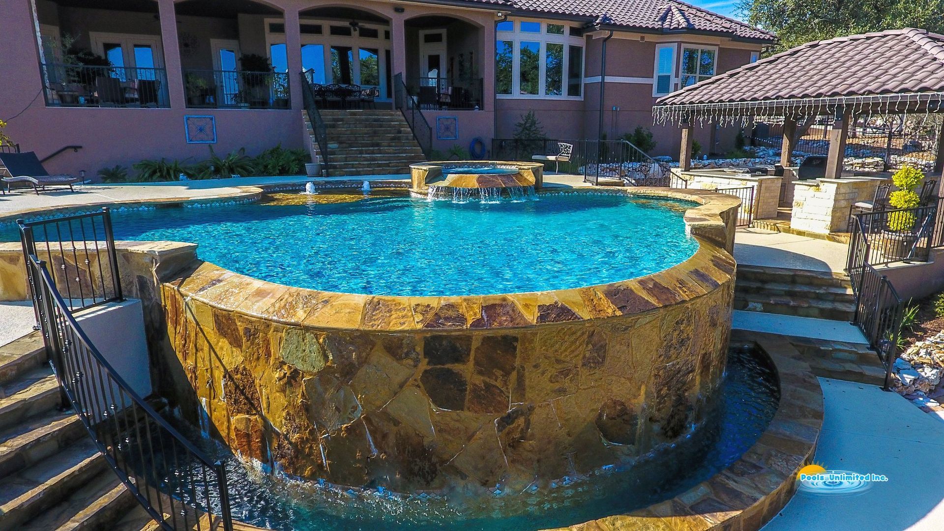 An aerial view of a swimming pool surrounded by lounge chairs.
