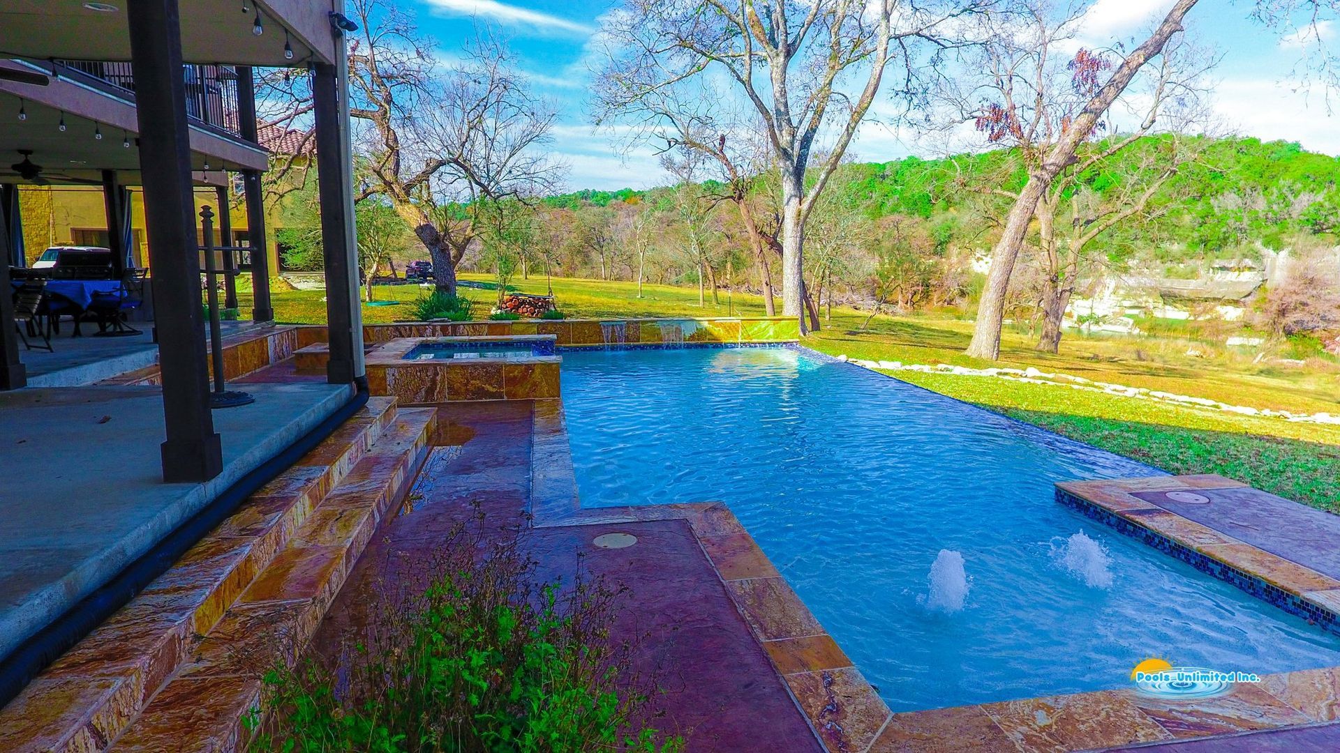 A large house with a large swimming pool in the backyard