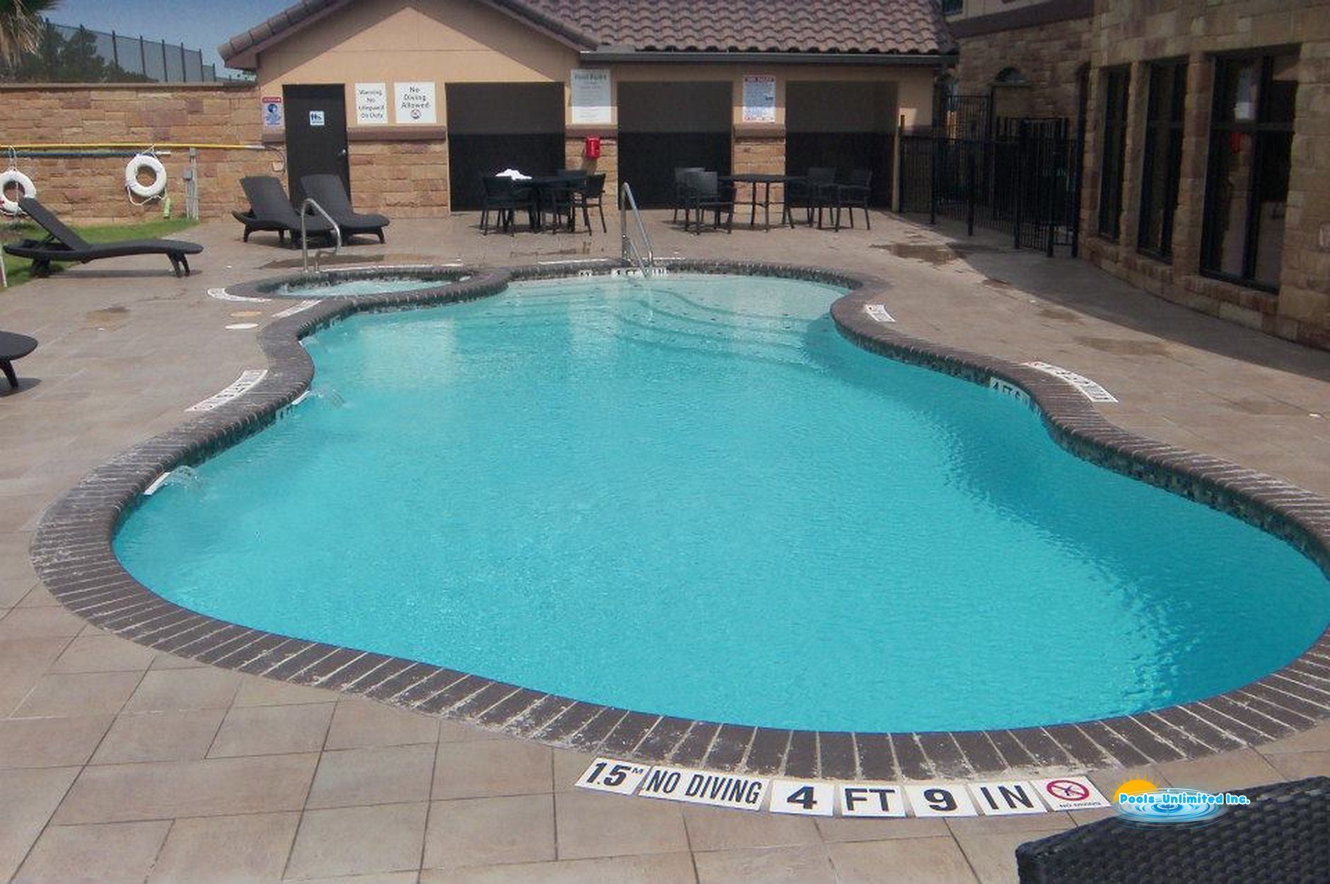 A large swimming pool that is 4 feet deep