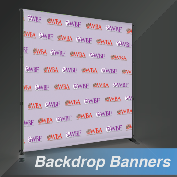 A backdrop banner with a repeating logo pattern, supported by a metal frame; light gray background.