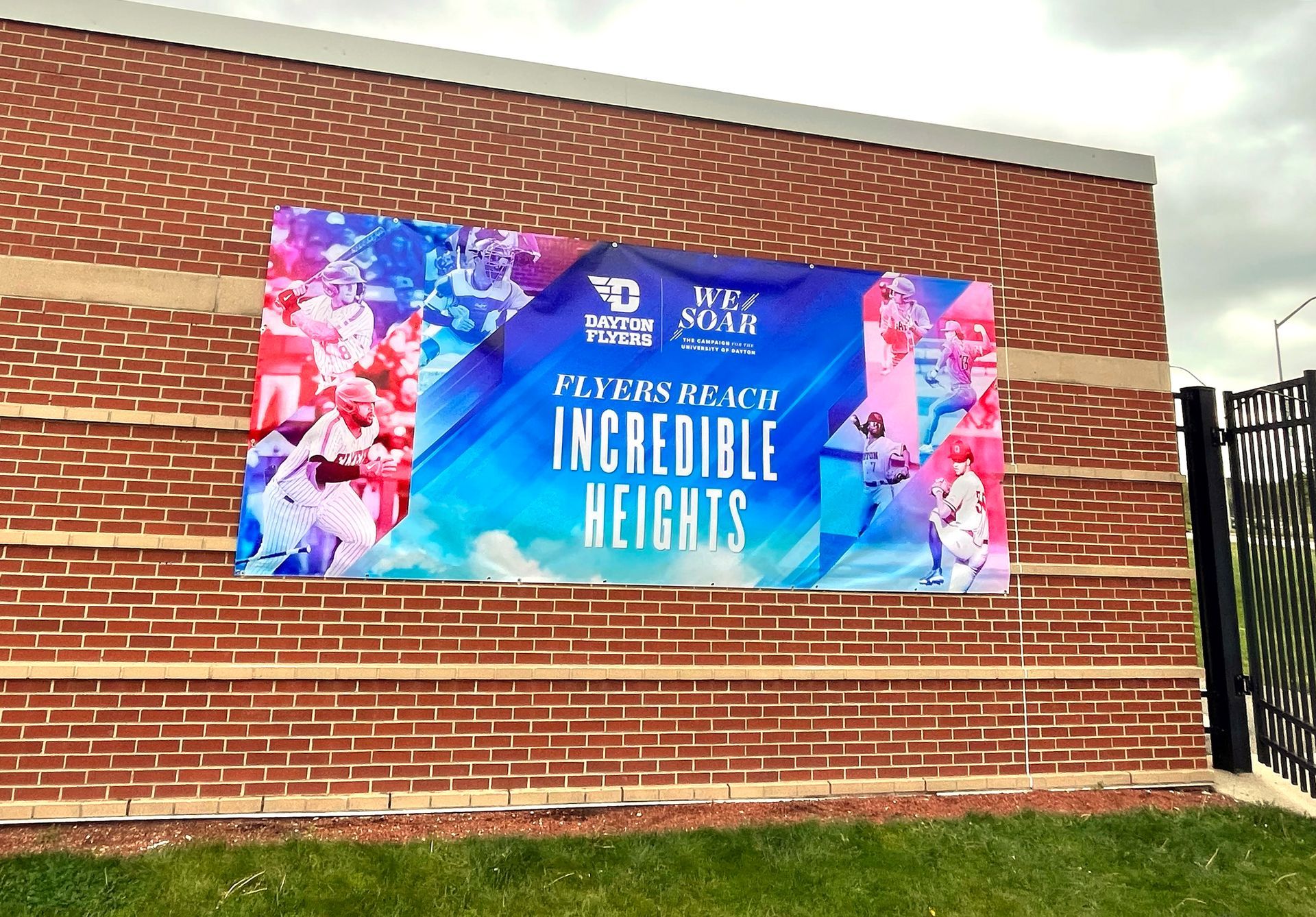 Banner on brick wall: