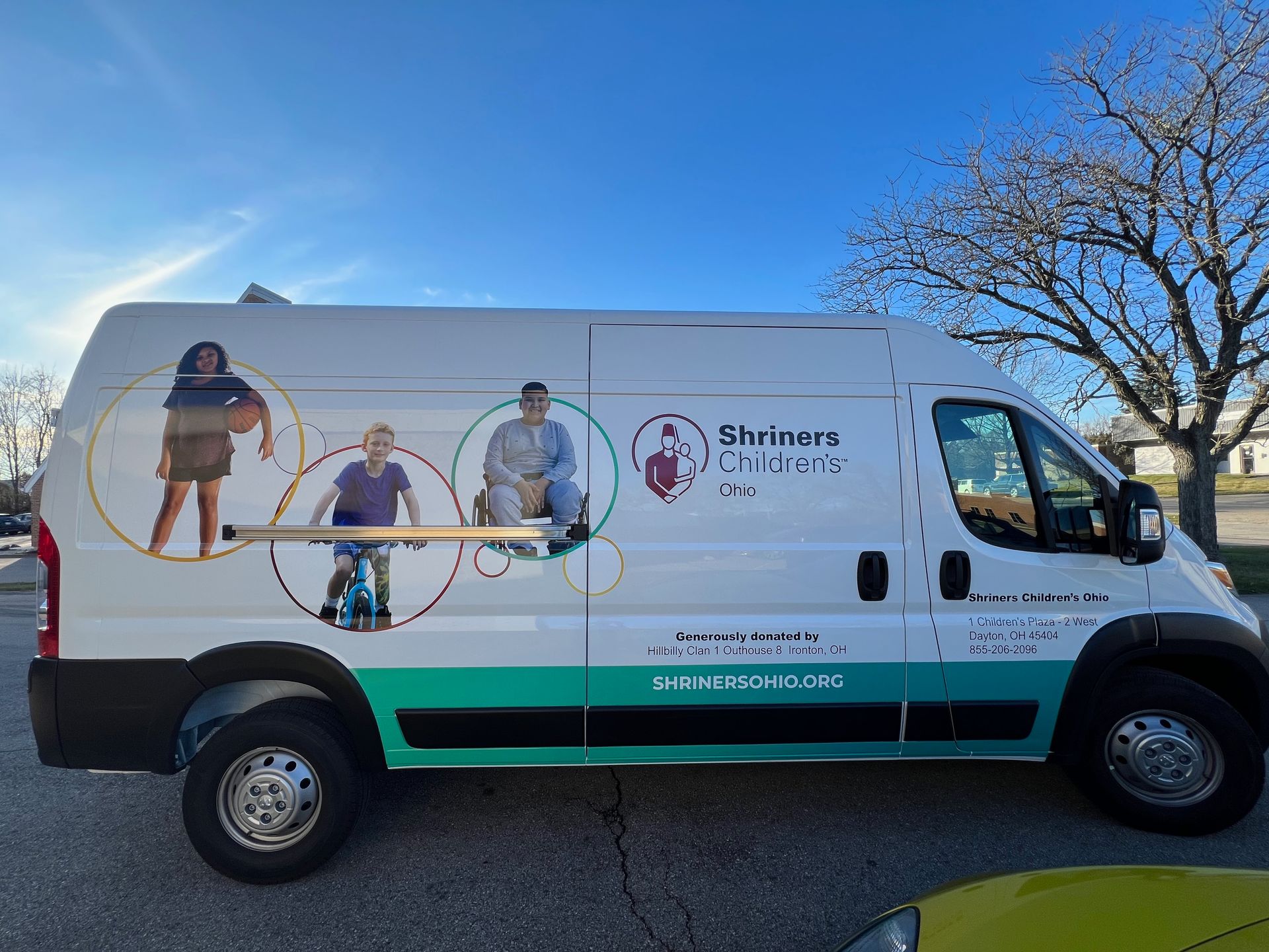 White van with teal accents,