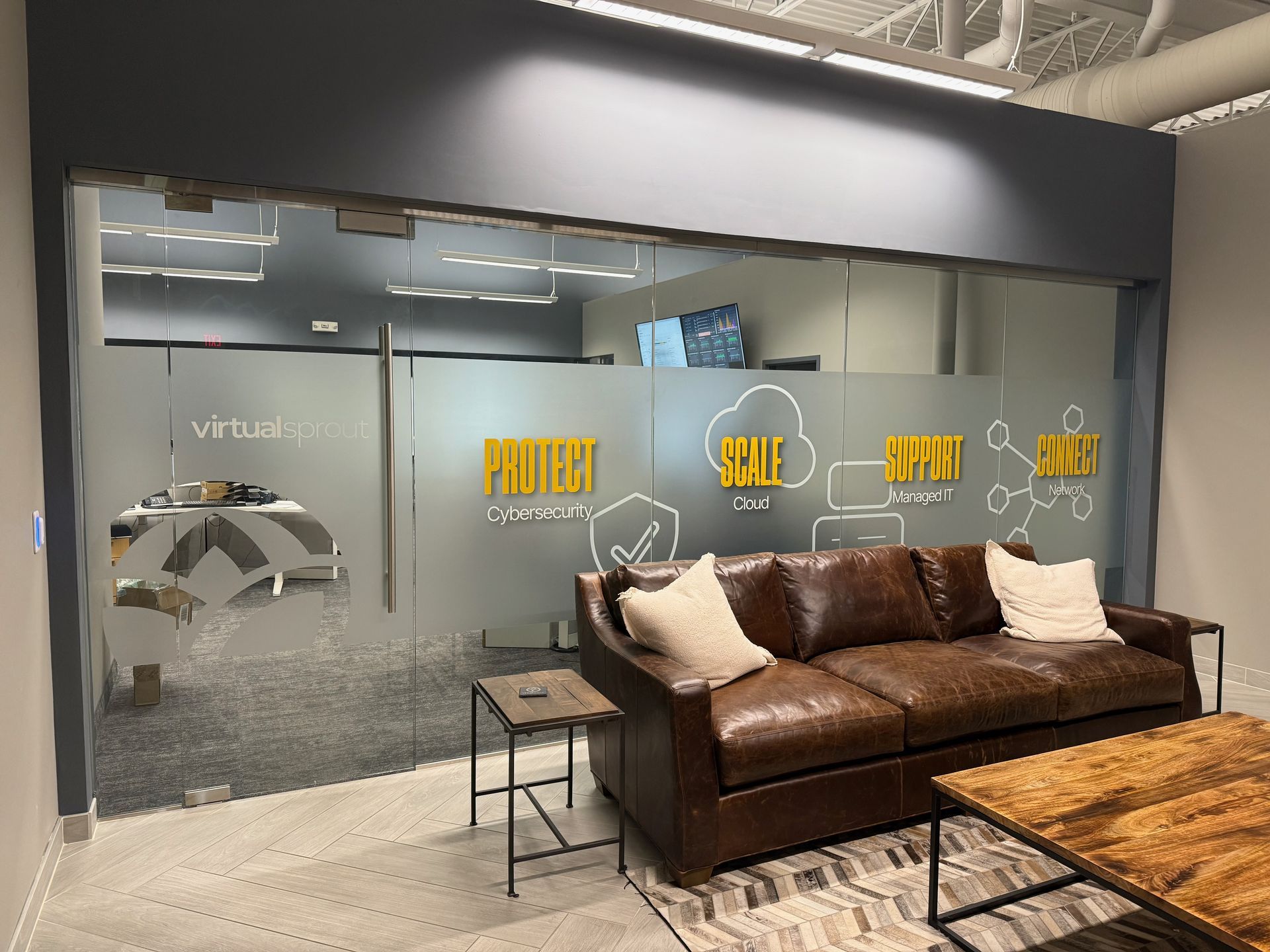 Lounge with frosted glass wall displaying 