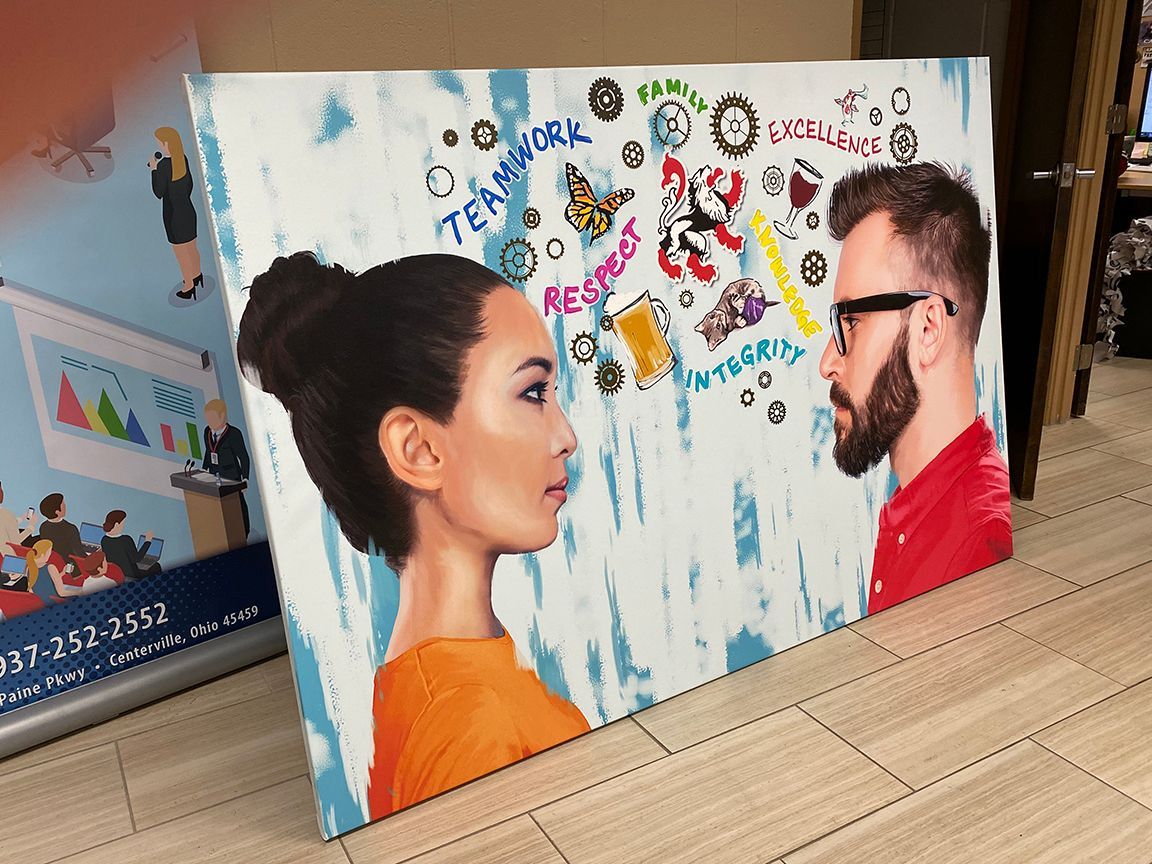 Painting of a woman and man facing each other, with teamwork-related words floating between them.