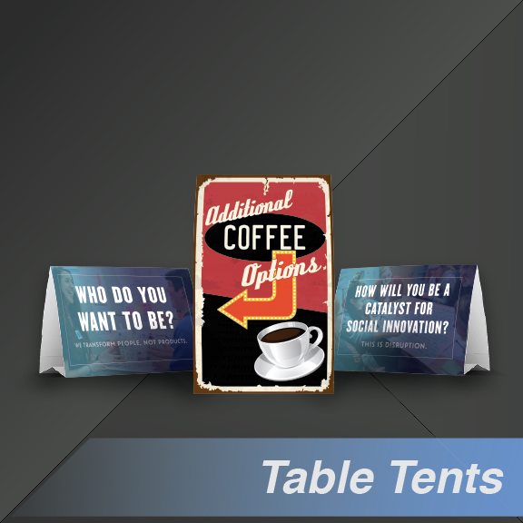 Table tent display: Coffee sign flanked by folded signs asking questions.