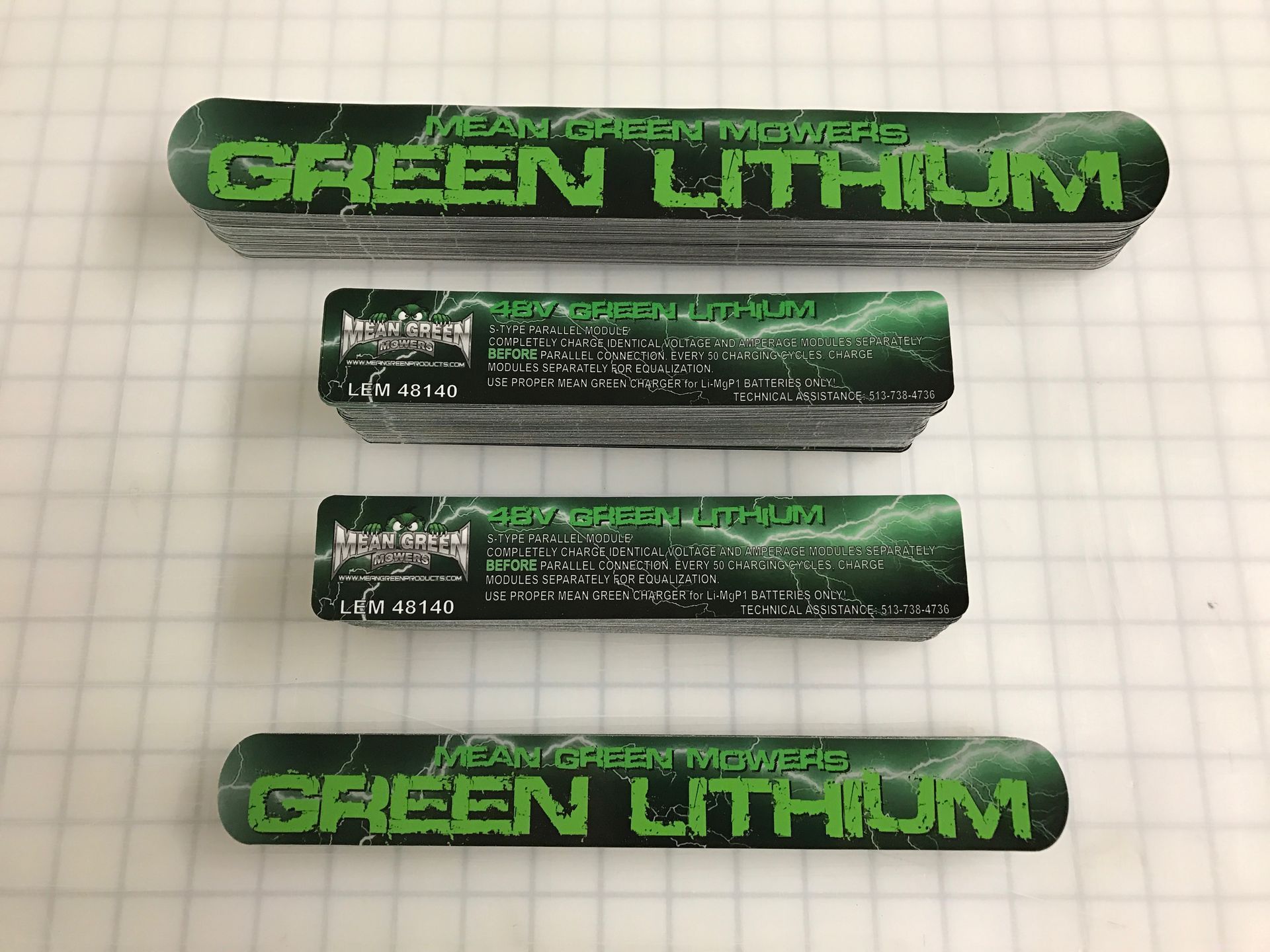 Four stacks of green and black