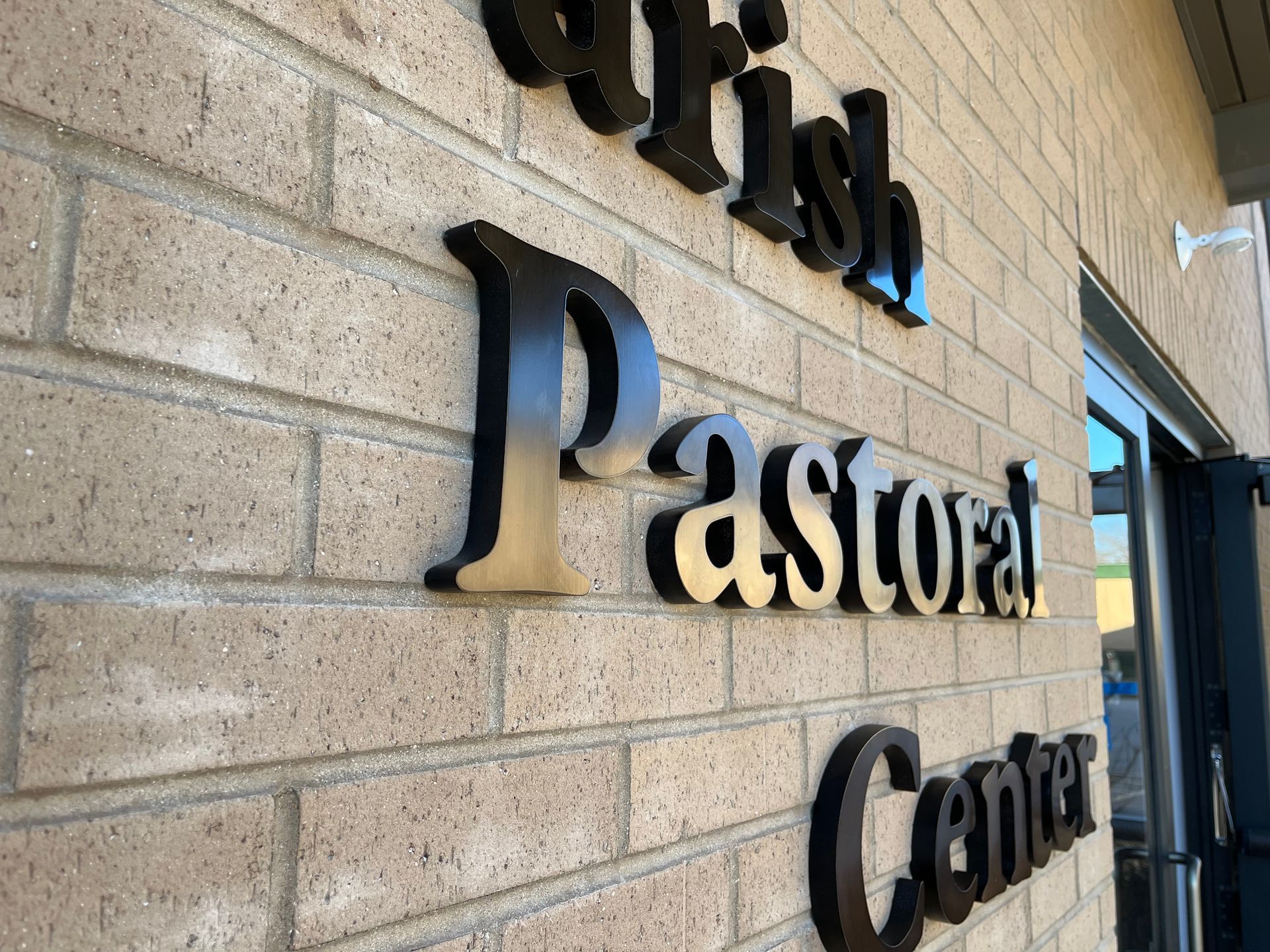 Sign on a brick building: