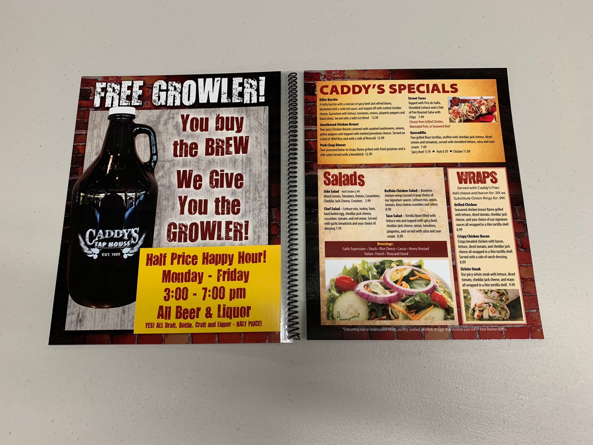Caddy's menu:  Offers free growler with purchase.  Includes specials, salads and wraps.