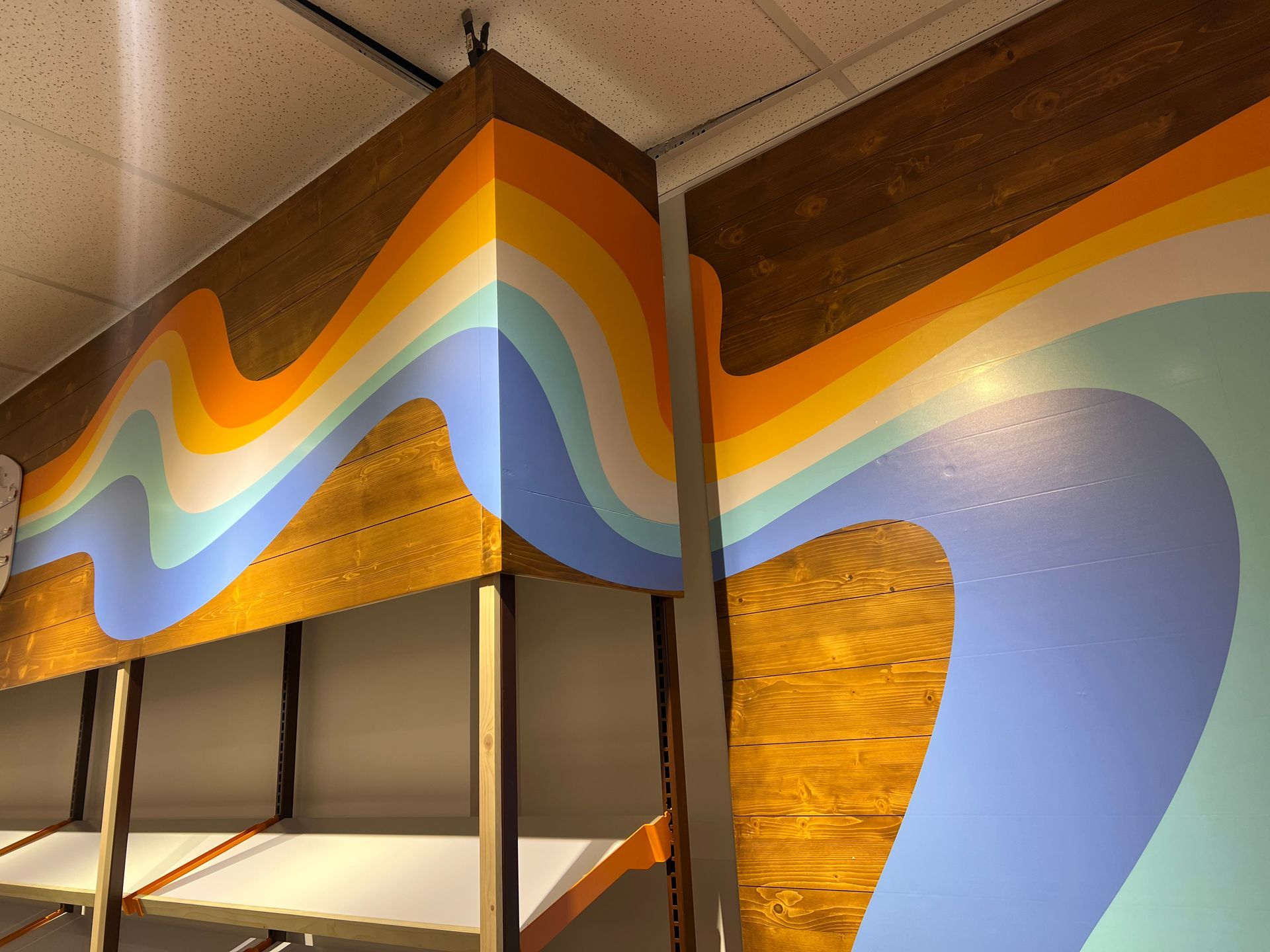 Wooden walls with a colorful retro wave design.