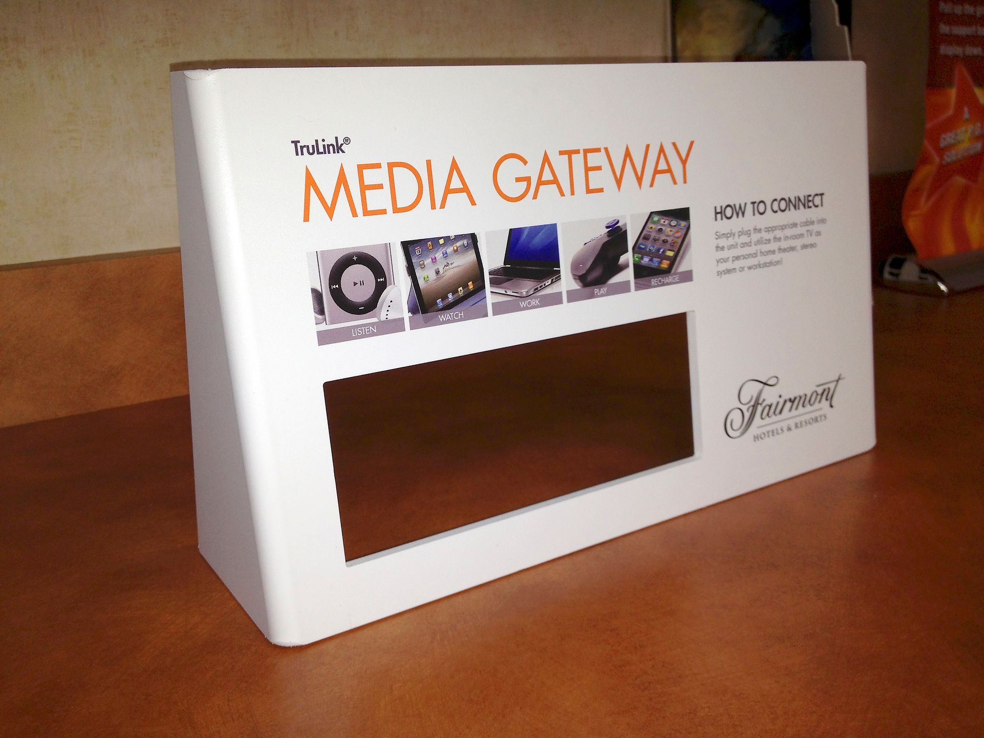 White Fairmont Media Gateway box with orange text and connected devices.
