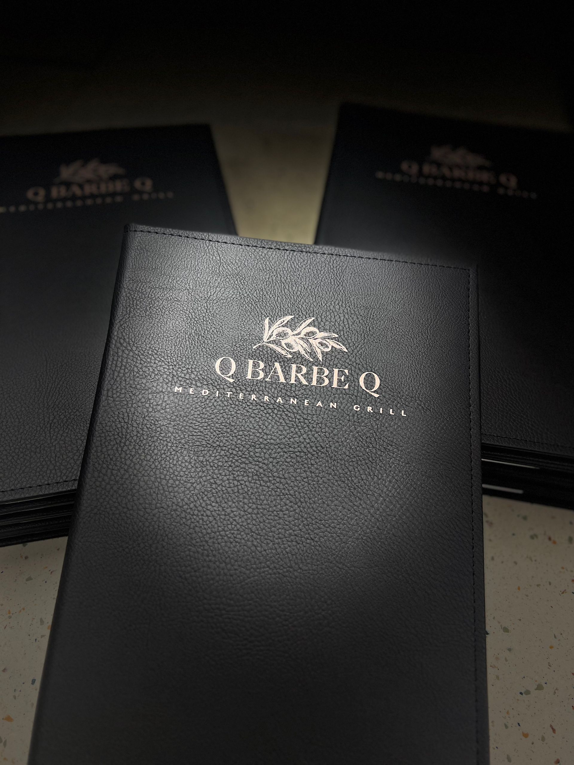 Black menus with silver lettering: