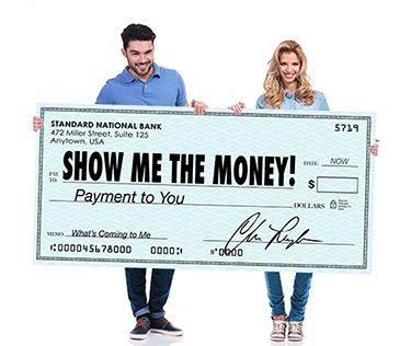A man and woman hold a giant check that reads