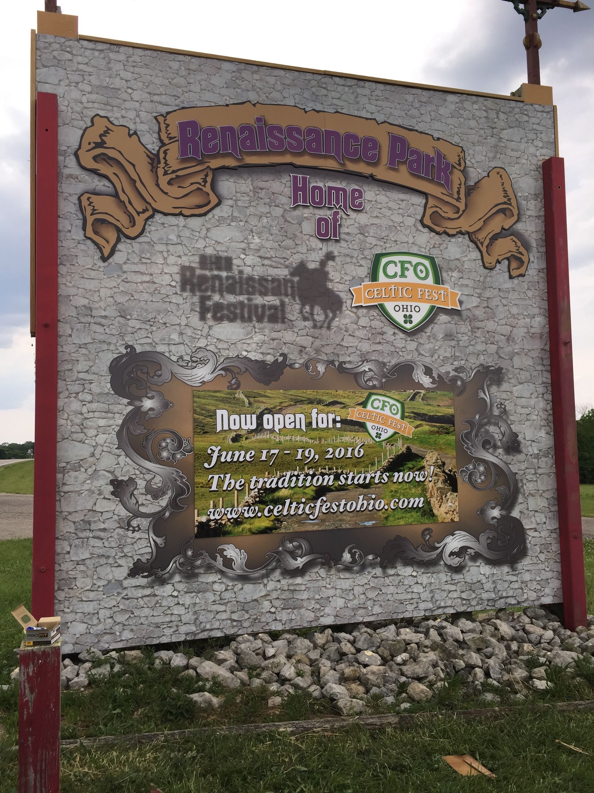 Sign for Renaissance Park, home of the Renaissance Festival. Grey textured background with open dates.