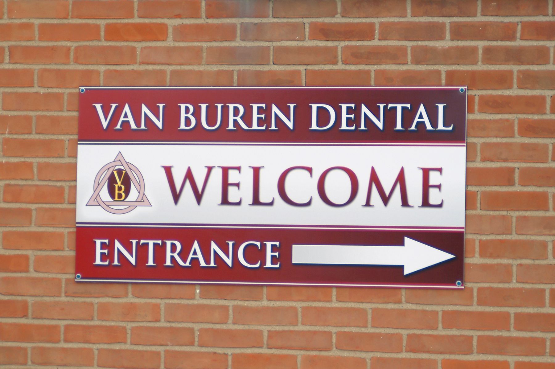 Sign for Van Buren Dental: burgundy and white text, 