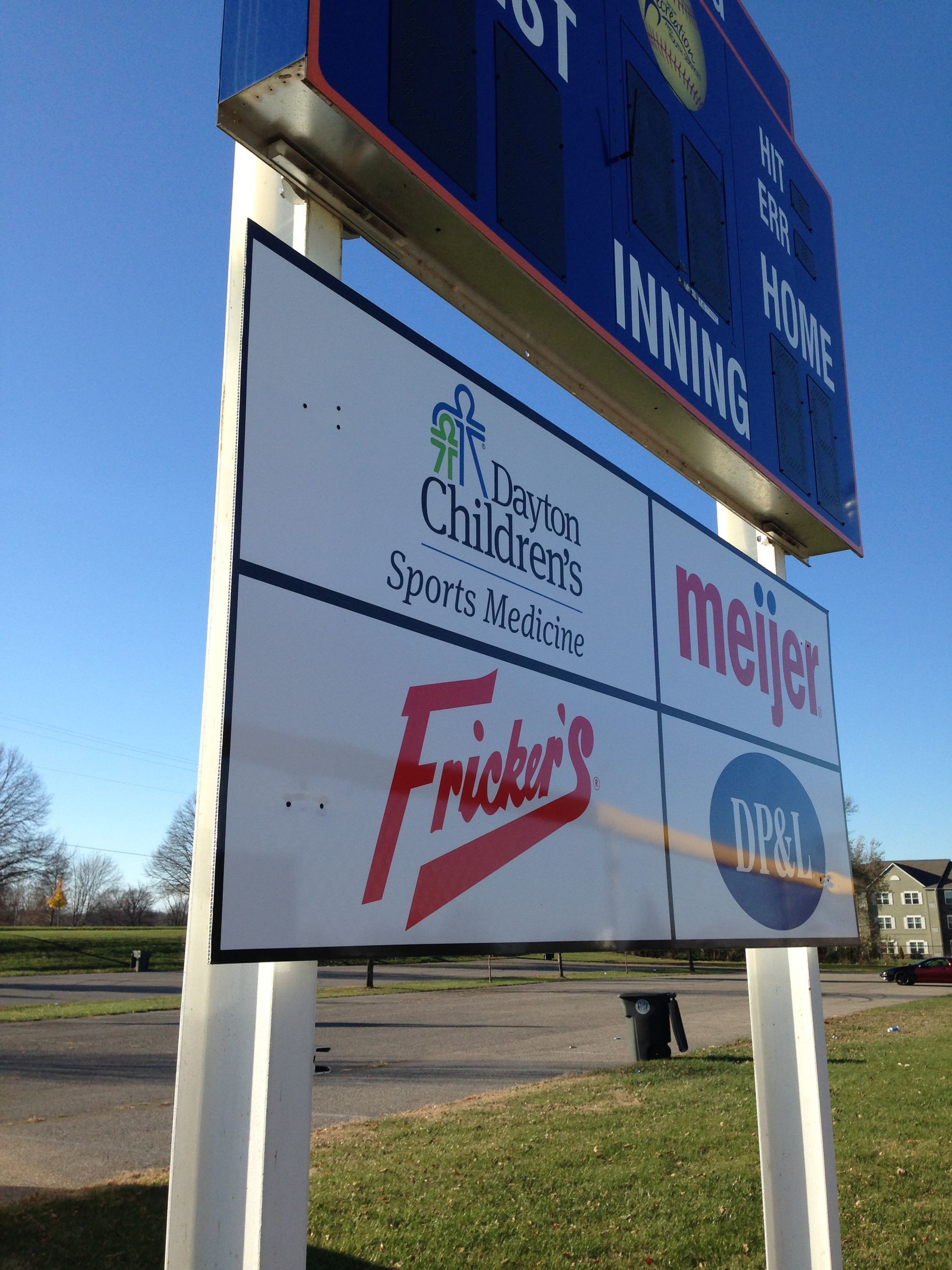 Sign with logos for Dayton Children's Sports Arena, Meijer, Fricker's, and a scoreboard.
