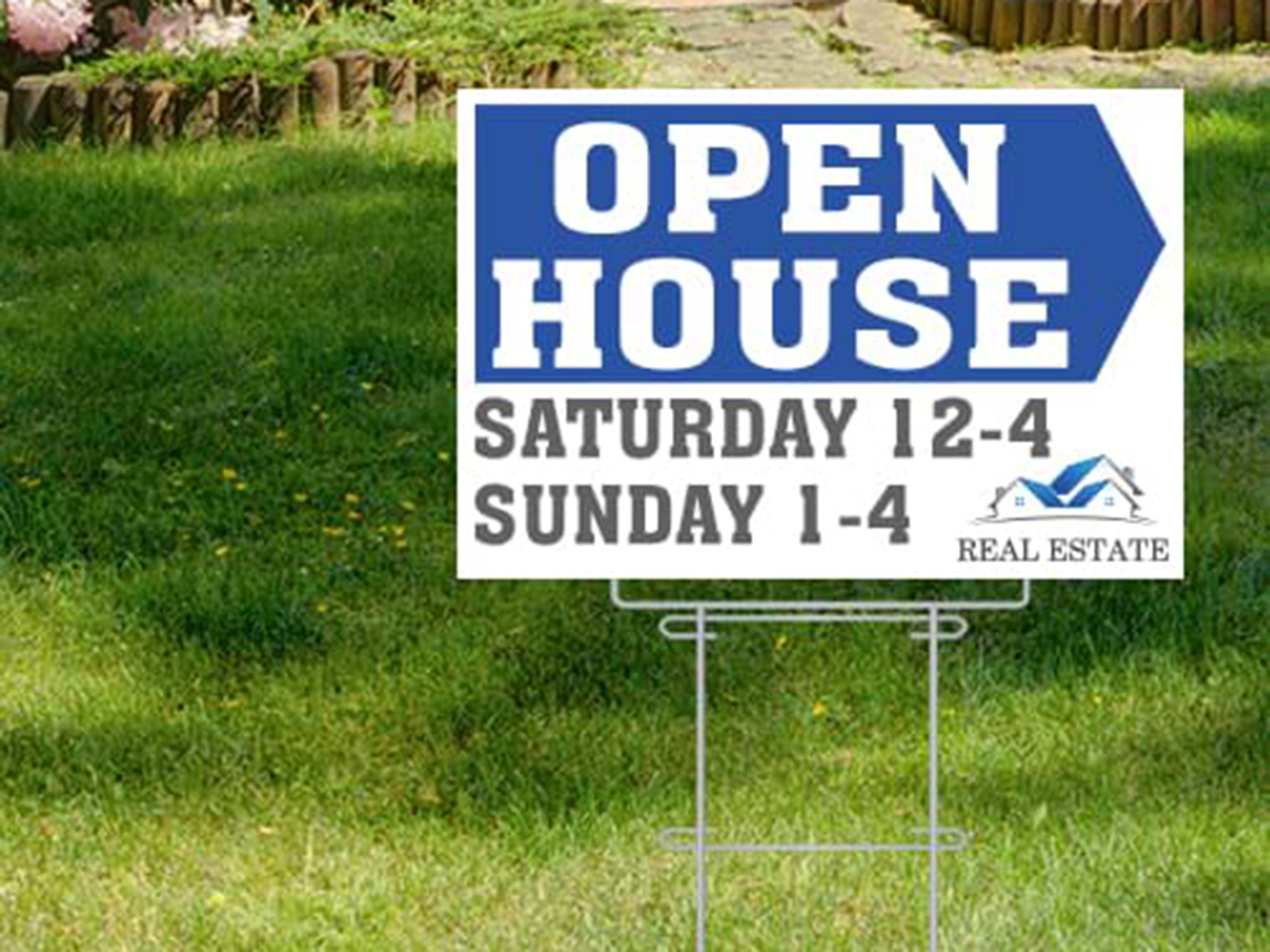 Open house sign on lawn: Blue and white, Saturday 12-4, Sunday 1-4. Real estate logo.
